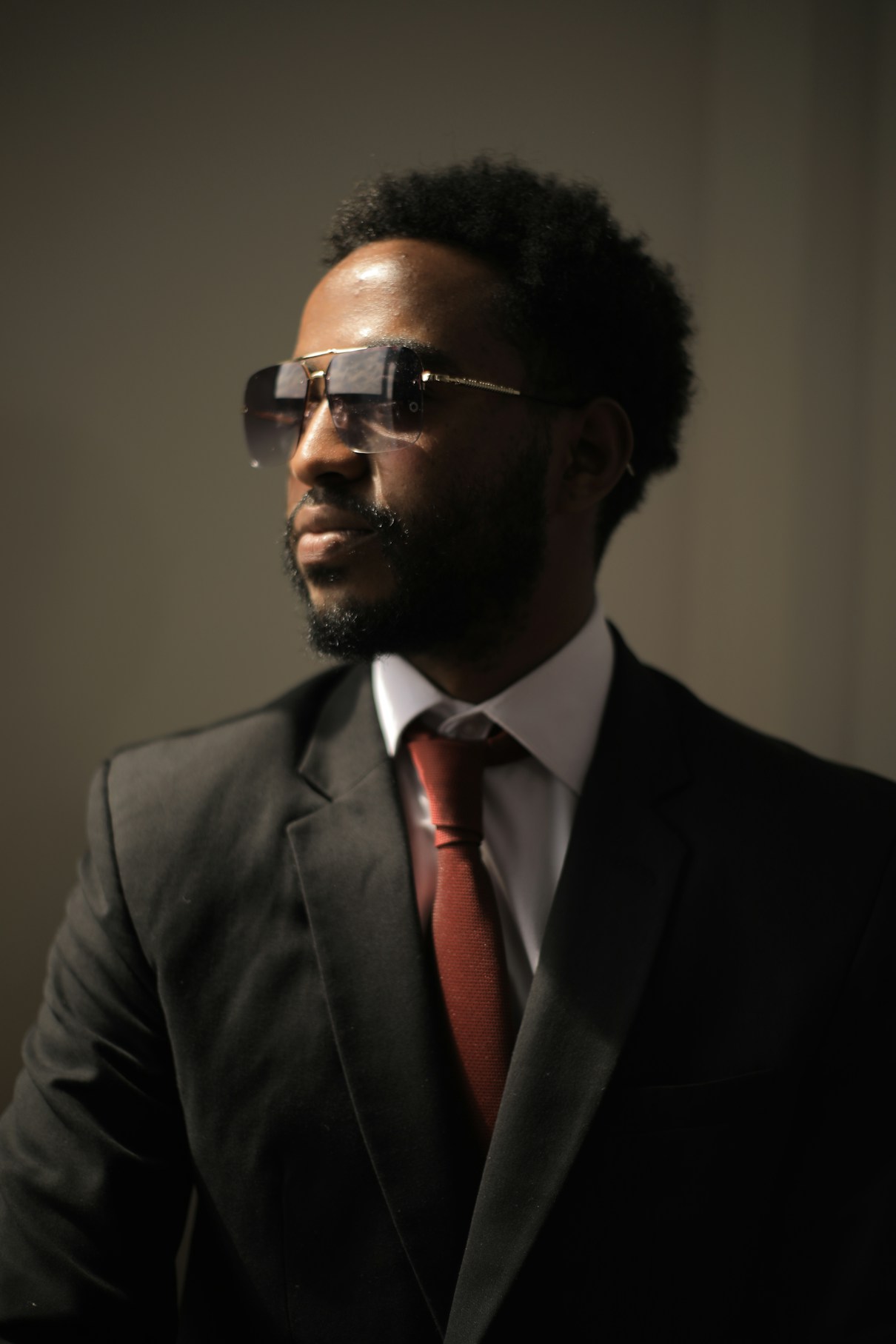 Alex, an aviation financial analyst in his early forties, in front of market charts